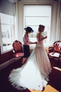 Laura's mum helping her into her dress