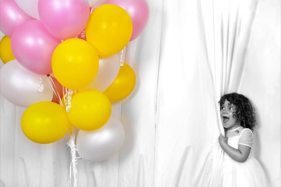 Lovely pink and yellow ballons little girl with colourful ballons