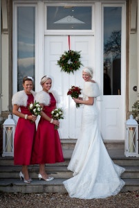 Laura's bridesmaids wore a stunning red, sinpired by the bride's ruby engagement ring.