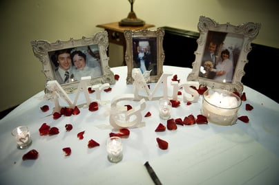 Laura and Andy framed pictures of their parent's wedding days next to a framed picture of their own big day.