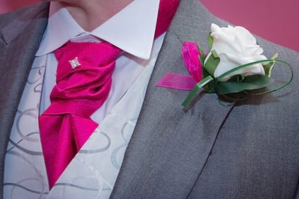 The groomsmen wore silk flowers