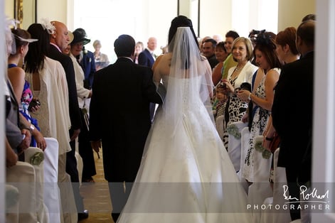 Nicole is walked down the aisle by her dad