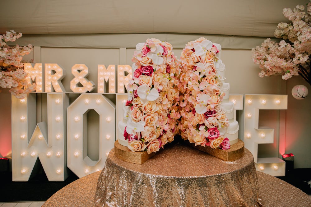 Split Flower Wall Wedding Cake